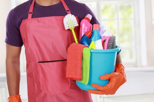 Technician treating stains on upholstery in Woolwich